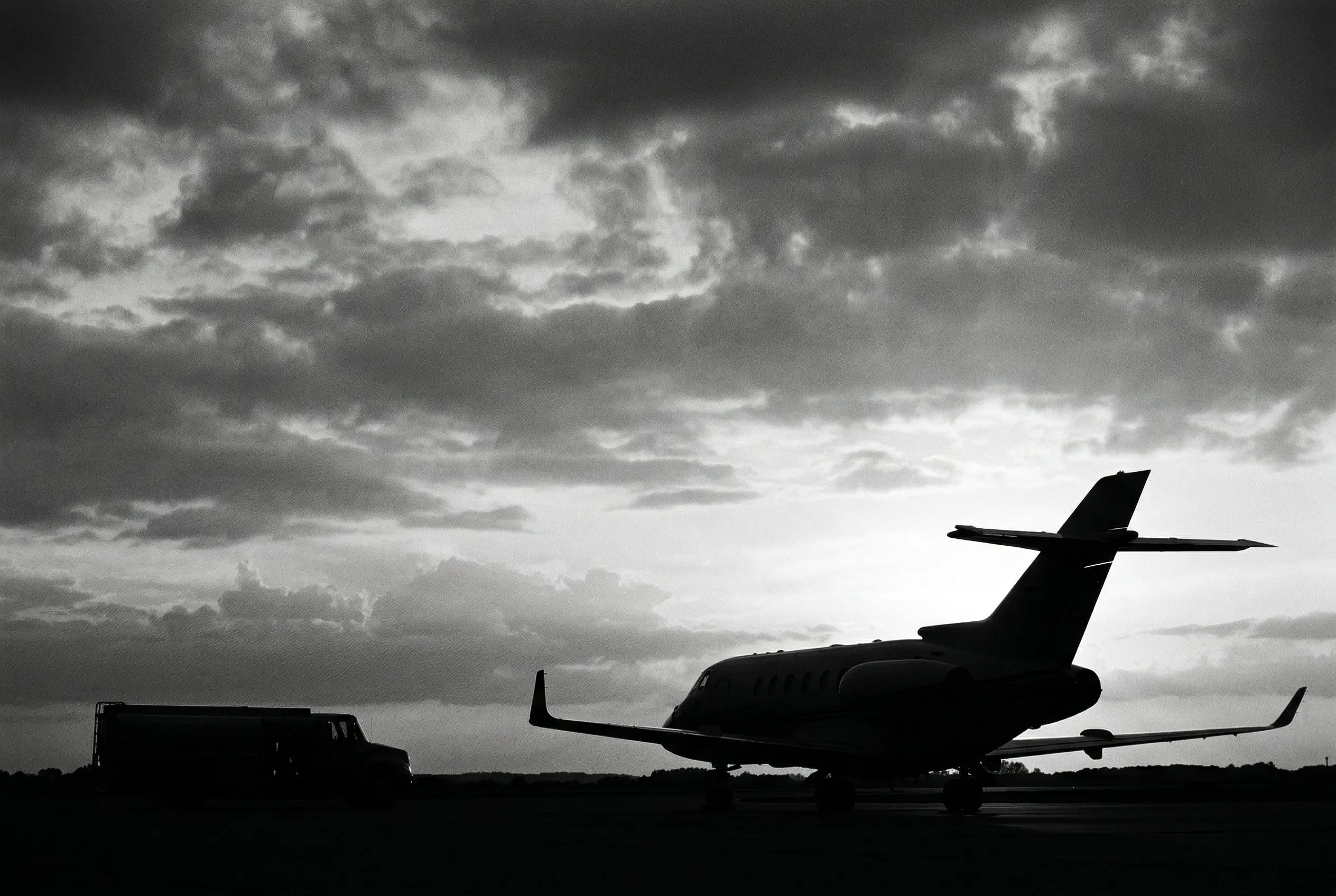 Hawker 800XP in flight at dusk with Honeywell TFE731 engines visible on the aft fuselage